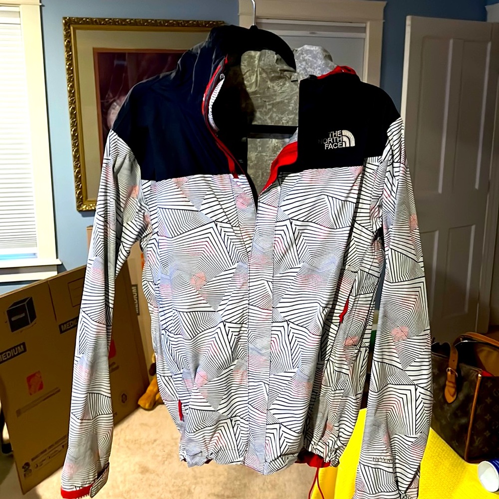 The North Face windbreaker size small.